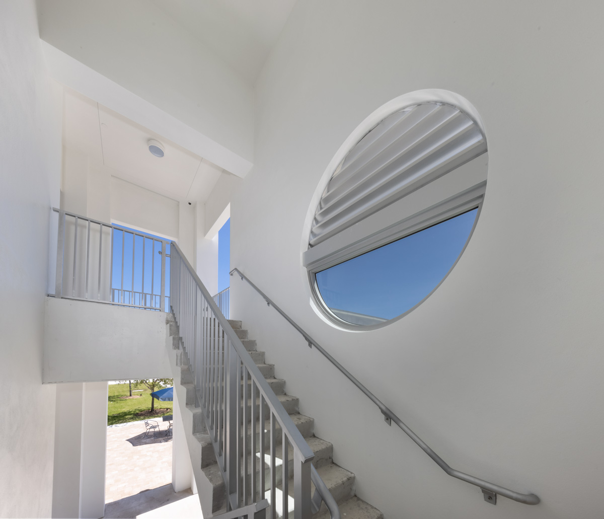 Architectural dusk photo of outdoor stairs at Palmer Trinity student center in Miami, FL